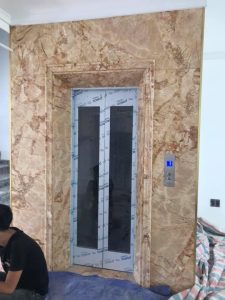 Đá ốp thang máy marble Sky Gold